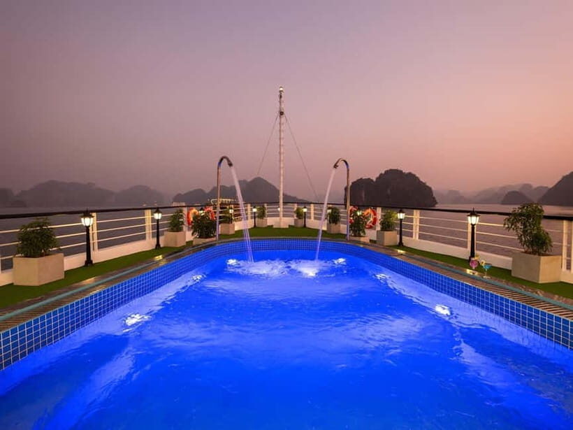 2-Day or 3-Day: Halong&Lan Ha Bay Cruise 5<em> balcony,bathtub – Dark & Bright Cave: Bamboo Boats and Kayaks Up Close’ /><br />
Day 3 is the limestone payoff. You get an early Taichi lesson on the sundeck, then breakfast while cruising through dramatic limestone islets as you head to Dark & Bright Cave.</p>
<p><p>The cave experience offers two ways to do it:</p>
</p>
<ul>
<li>Explore by kayak on your own</li>
<li>Or take a <strong>bamboo boat</strong> rowed by locals</li>
</ul>
<p><p>Both options change the experience. Kayak time gives you control and often more quiet moments as you work through the water and rock. The bamboo boat option leans into local guiding and a smoother ride through narrow sections.</p>
</p>
<p><p>This is also where the 2-day vs 3-day choice becomes clear. In the 2-day version, you skip Viet Hai Village and go straight to the cave on your second day. If you want both Lan Ha village life and the cave, choose 3 days. If your priority is classic Halong-Lan Ha highlights with less time on land, 2 days works.</p>
</p>
<p><p>After the cave time, you head back to the cruise, check out, and have lunch onboard. Then you leave the ship and return toward Tuan Chau pier, with car transfer back to Hanoi. The last stretch usually means you’ll arrive back in the Old Quarter around mid-afternoon.</p>
</p>
<h2 id="price-and-value-at-around-148-what-youre-really-paying-for">Price and Value at Around $148: What You’re Really Paying For</h2>
<p><img width="820" height="637" decoding="async" src=