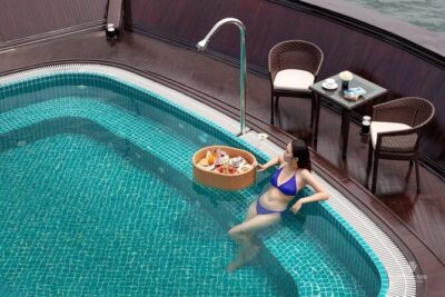 2 Days and 1 Night Halong Bay Luxury Genesis Regal Cruises - Day 1 on the bay: caves, floating houses, kayaking choices, and sunset squid