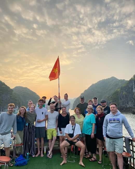 Cat Ba: Day boat tour with: kayak, cave, bike, meal, tickets - Ba Trai Dao beach swim: blue water, deck jumps, and calm bays