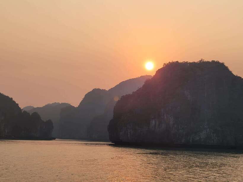 Cat Ba: Day boat tour with: kayak, cave, bike, meal, tickets - Viet Hai village by bike: rice fields, friendly fishermen, and fish massage