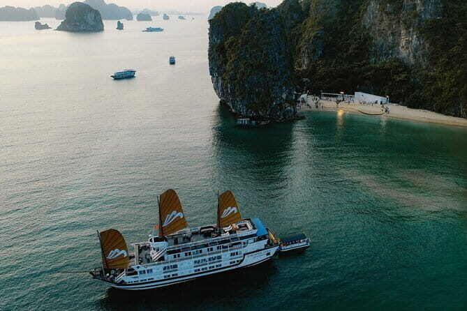 Emeraude Cruise 2 days 1 night Ha Long Bay Tour - Daybreak rituals: tea, cakes, and yoga on deck