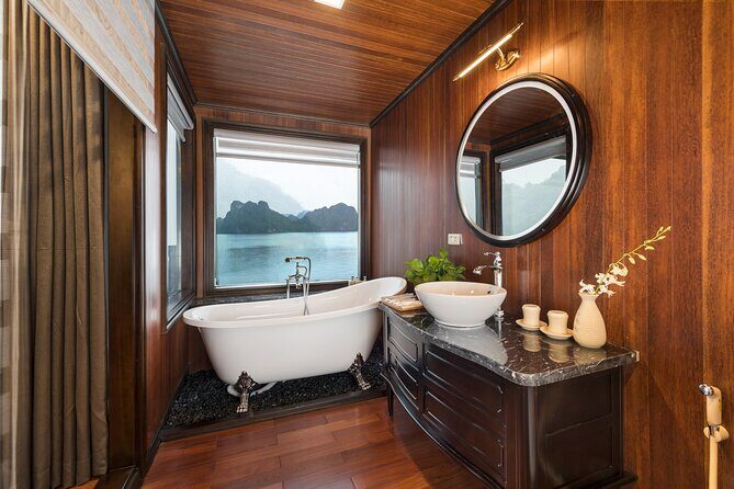 HA LONG BAY - LAN HA CAT BA 2D1N on LA REGINA CRUISE 5<em> LUXURY – Meals onboard: 4 meals, plus water, in a comfortable setting’ /><br />
Food is a big part of why people stick with a cruise plan instead of booking everything separately. This experience includes <strong>breakfast, lunch, and dinner</strong>, plus <strong>bottled water</strong>. The overview also promises <strong>four delicious meals</strong>, so you can expect more than just the three main meals listed—there’s likely an additional meal or special serving during the day schedule.</p>
<p><p>One more thing: the ship’s design style tends to make meals feel more like dining than “cafeteria on a boat.” If you want a break from constant moving, this is where you slow down. You’ll sit down, eat, and let the scenery pass.</p>
</p>
<p><p>Gala dinner is a possible extra cost. The included list does not cover alcohol or tips, and there’s a note about <strong>an extra $39 USD per person for gala dinner</strong> on Dec 24 and 31. If you’re traveling around those dates, confirm whether your departure includes it as standard or if it’s an add-on.</p>
</p>
<h2 id="spa-time-and-onboard-downtime-why-that-comfort-matters">Spa time and onboard downtime (why that comfort matters)</h2>
<p><img width="669" height="446" decoding="async" src=
