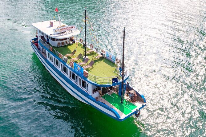 Halong Bay Day Tour With Titop Island, Cave, Kayak & Lunch - Sunset party: fruit, cake, and a good photo moment