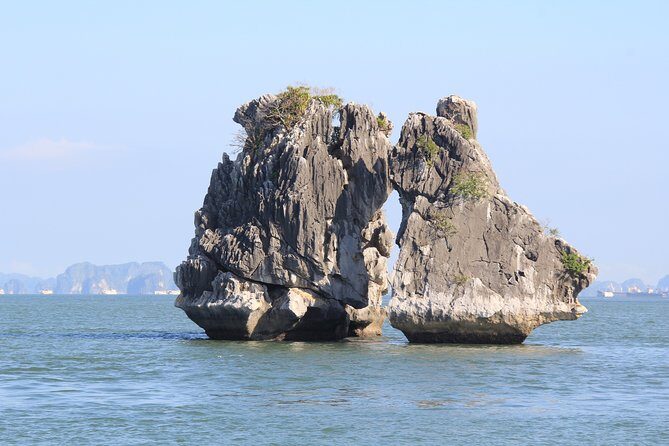 Halong bay full day trip: Visit Surprise cave, Titop island, kayaking & swimming - Titop Island: climb for panorama or choose the beach