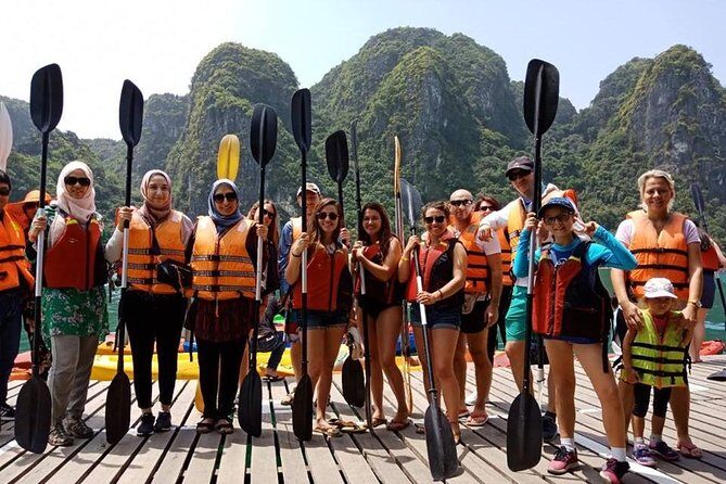 Halong Bay Islands and Caves: Full-Day Tour from Hanoi - Floating Village by Bamboo Boat: Market Views From the Water