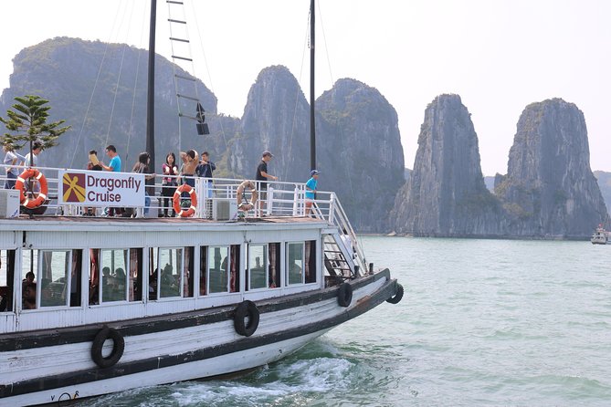 Private Transfer Hotel Pick Up for Small Group Halong Day Tour - Lunch onboard: seafood meal, table setup, and water